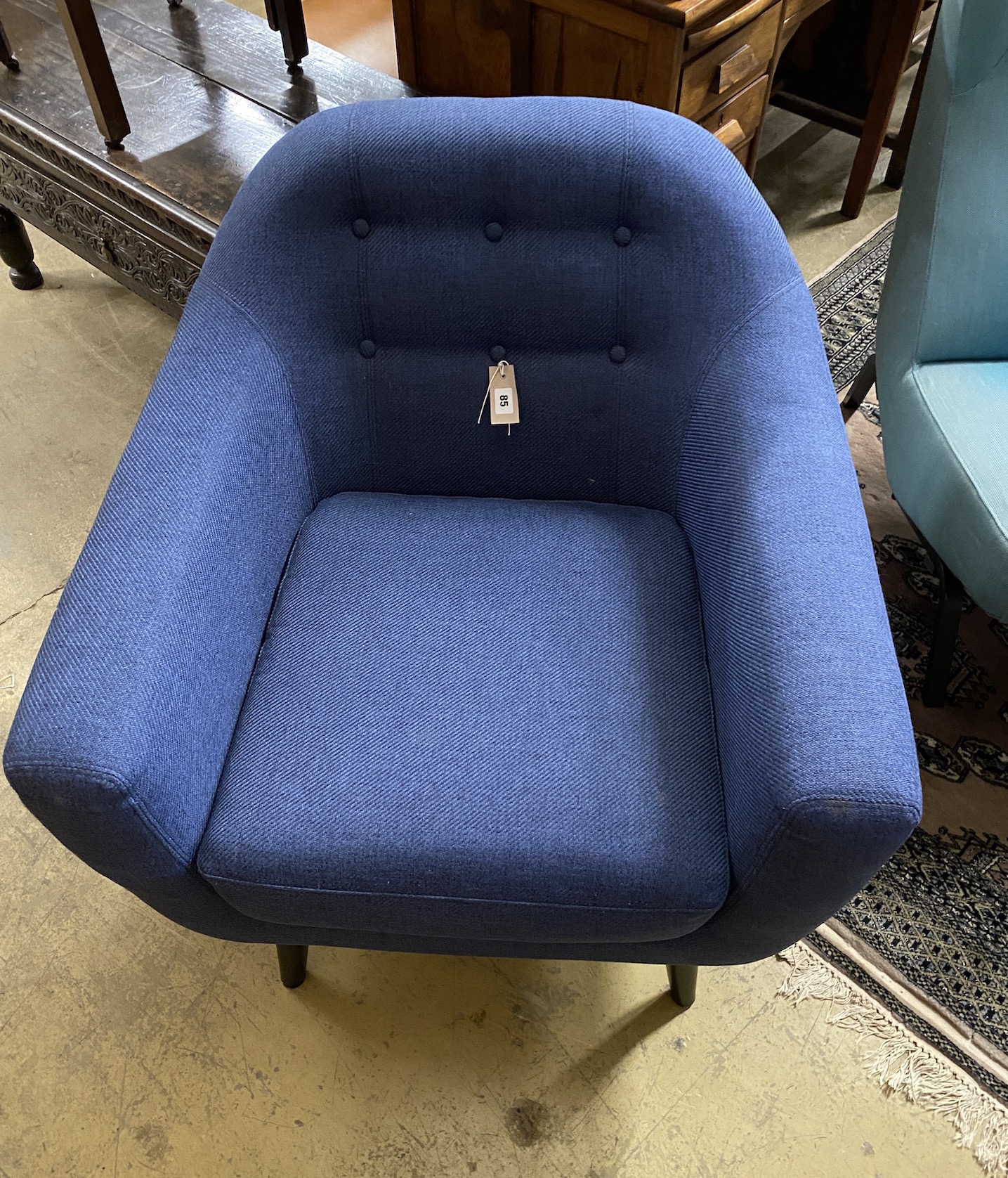 A contemporary blue fabric armchair, width 81cm, depth 74cm, height 84cm